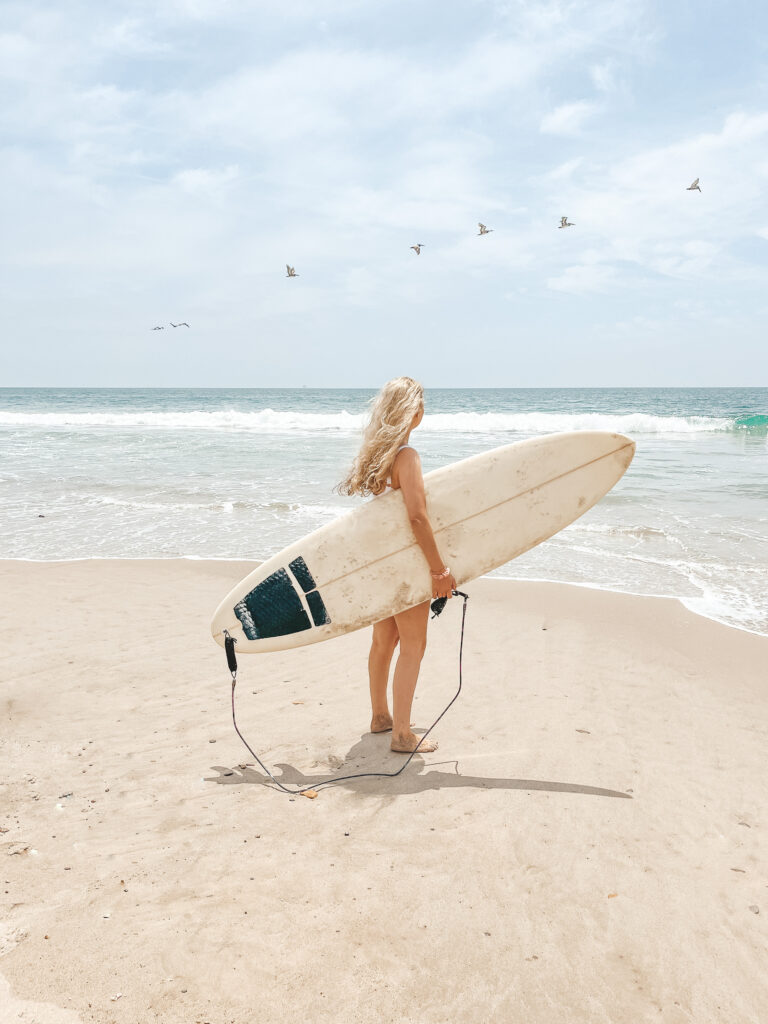 Solo Travel After 40 Will Change the Way You Experience Your Life female surfer