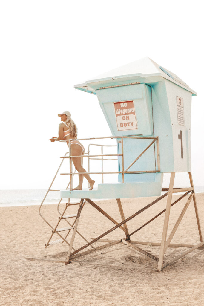 Solo Travel After 40 Will Change the Way You Experience Your Life woman in lifeguard stand