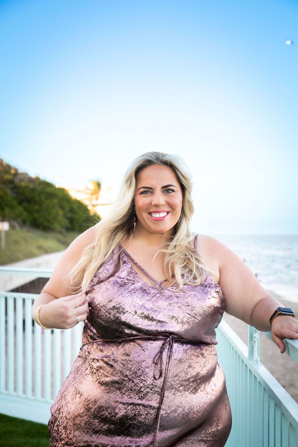 Alessia Tenebruso glowing with confidence on a seaside balcony