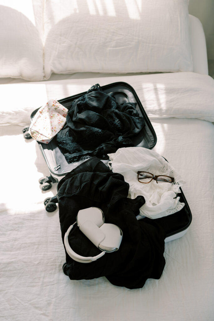 luggage open on bed
