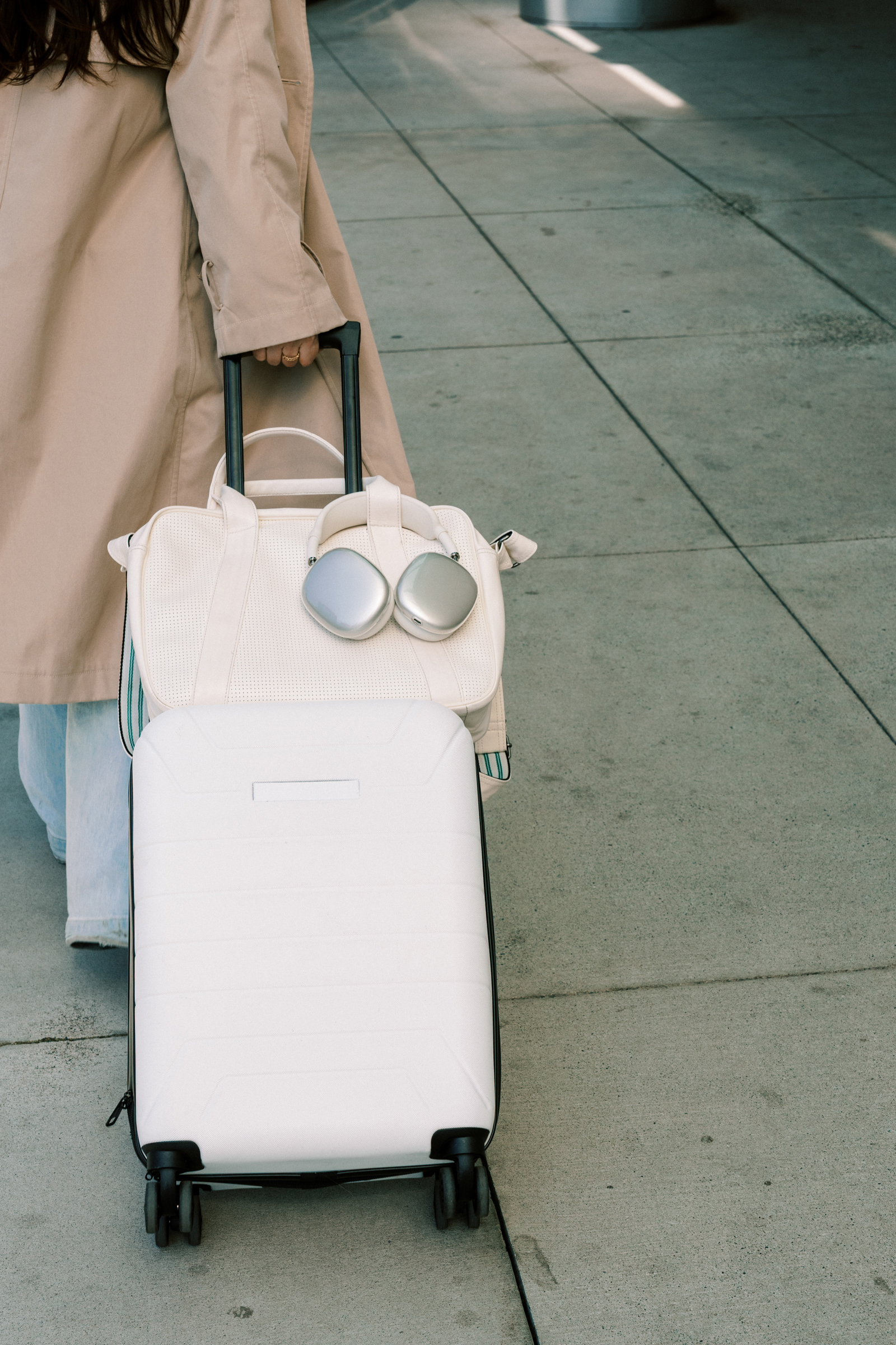 woman rolling her suitcase
